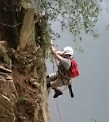 PNHP assisted PGC staff with peregrine falcon
banding at a nest site. Here, WPC herpetologist
Charlie Eichelberger climbs a rock face to
investigate one of the state’s only cliff nests.
Photo by: Cal Butchkoski, PA Game Commission