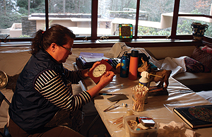 Victoria Jefferies, a wood conservator, works on
some of the objects in the Fallingwater collections.